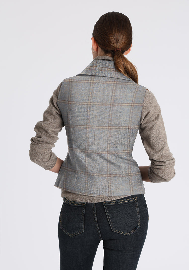 Person wearing a blue-gray checkered waistcoat on a white background