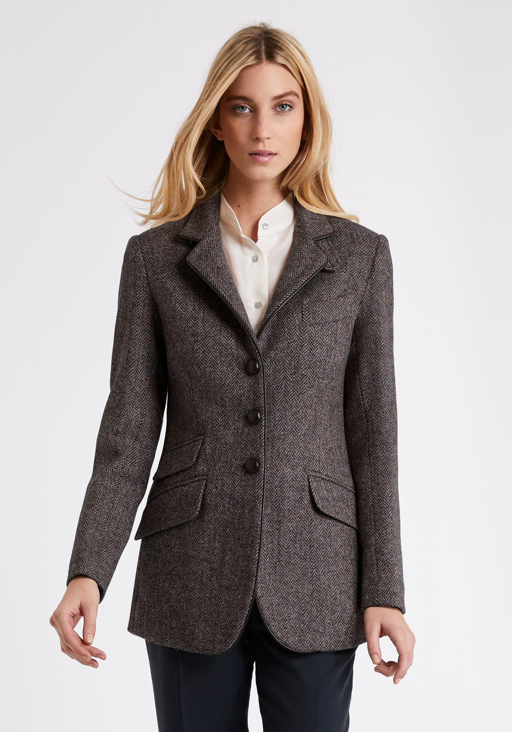 Model wears the Cass jacket, a relaxed boyfriend-style jacket with subtle equestrian inspired detailing.