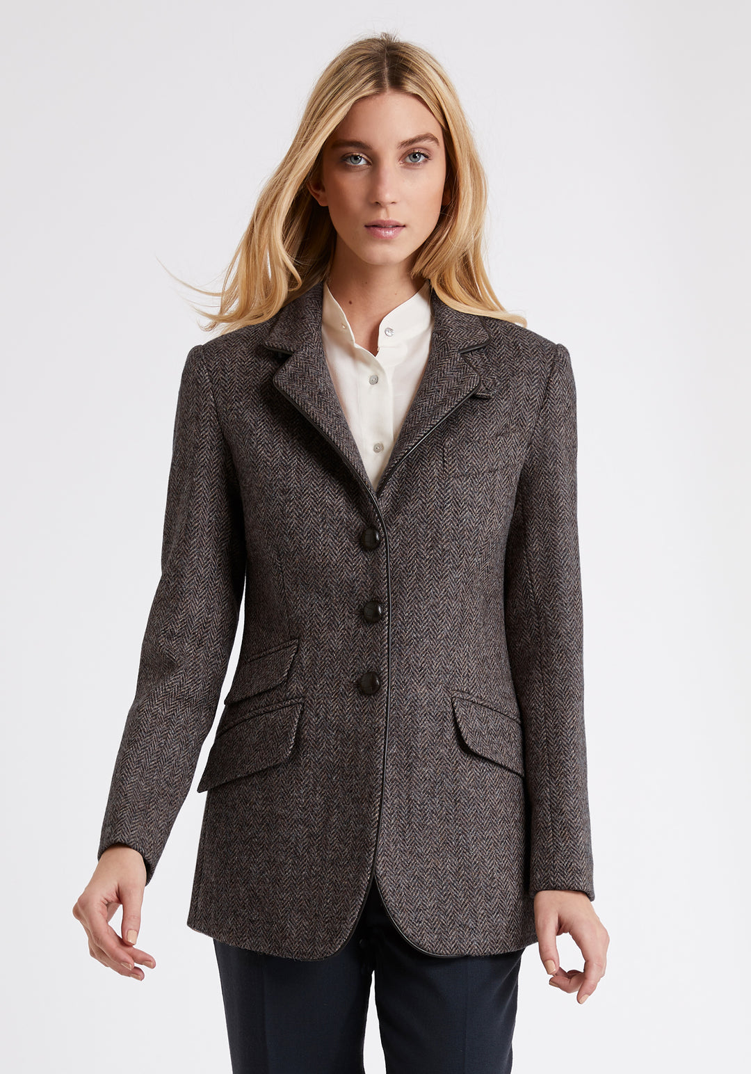 Model wears the Cass jacket, a relaxed boyfriend-style jacket with subtle equestrian inspired detailing.