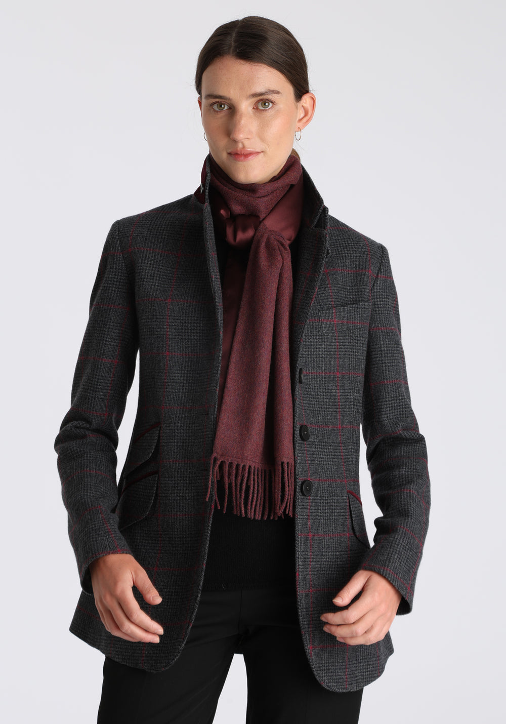 Model wearing the shiraz marl cashmere scarf backed with burgundy silk, over the Cass jacket in winterberry check.
