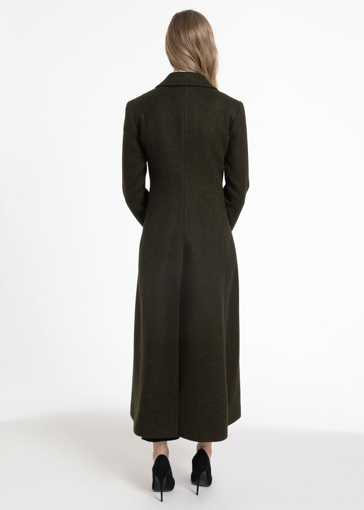Back view of a woman wearing a dark olive wool coat.