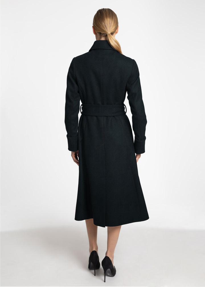 A back view of a woman wearing a dark green wool belted coat.