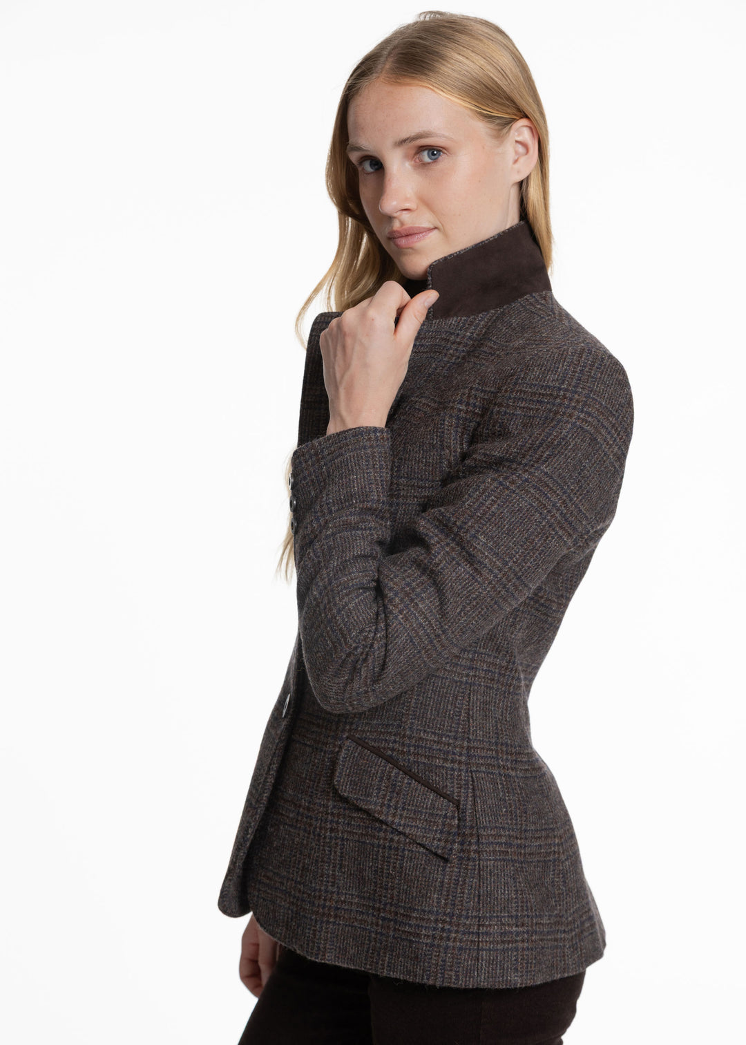 A woman modeling a dark brown and gray plaid jacket with a high dark brown collar, photographed against a solid white background.