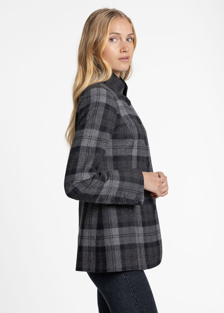 A woman modeling a dark gray and black plaid button-up jacket, shown from a side profile against a plain white studio background.