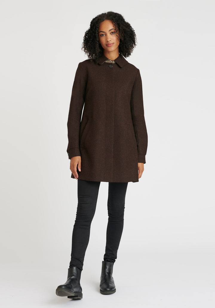 A woman wearing a brown wool coat with a top button. 