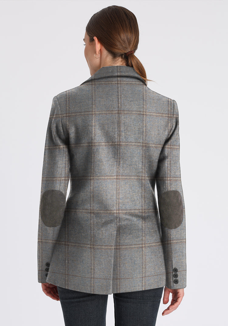 Back of woman wearing blue grey check jacket with grey elbow patches