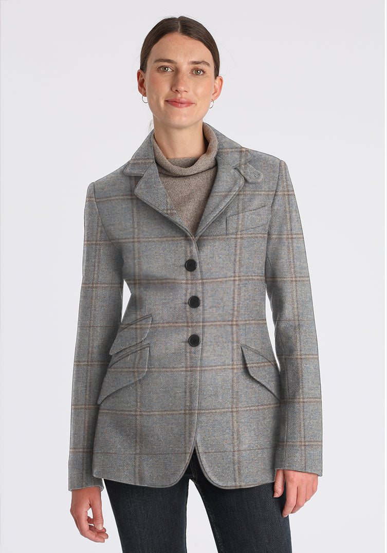 Woman wearing blue grey check wool jacket with black buttons