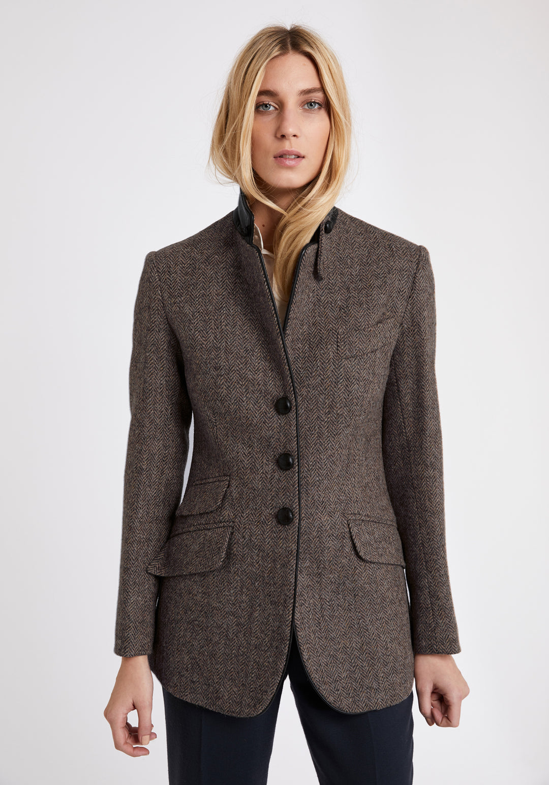 A model wears the Cass jacket, a relaxed boyfriend-style jacket with subtle equestrian inspired detailing.