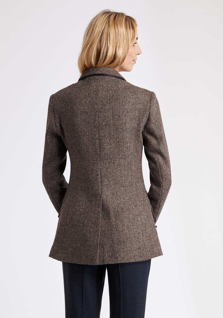 A model wears the Cass jacket, a relaxed boyfriend-style jacket with subtle equestrian inspired detailing.