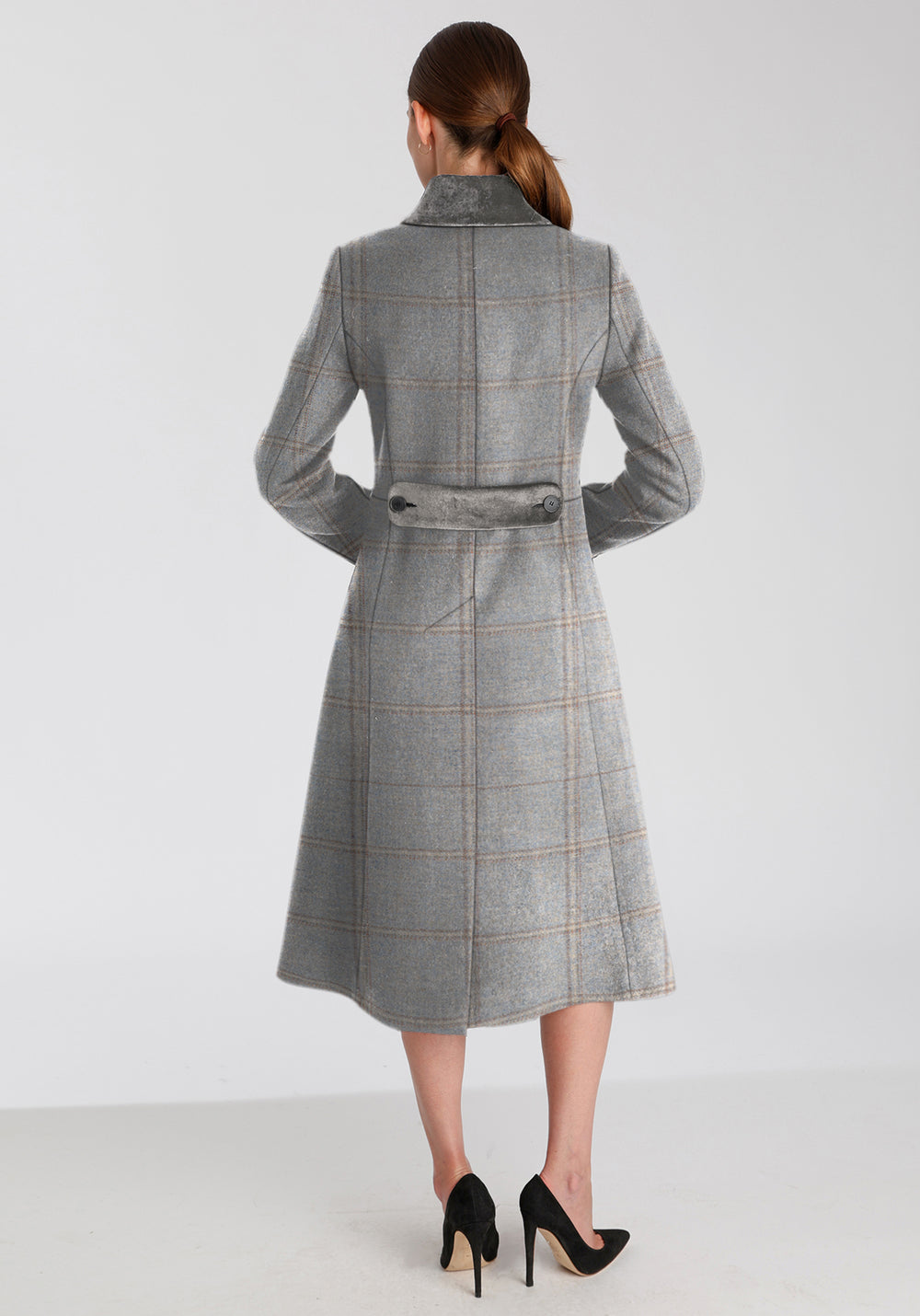 Back of woman wearing blue check coat with silver grey collar and back belt detailing