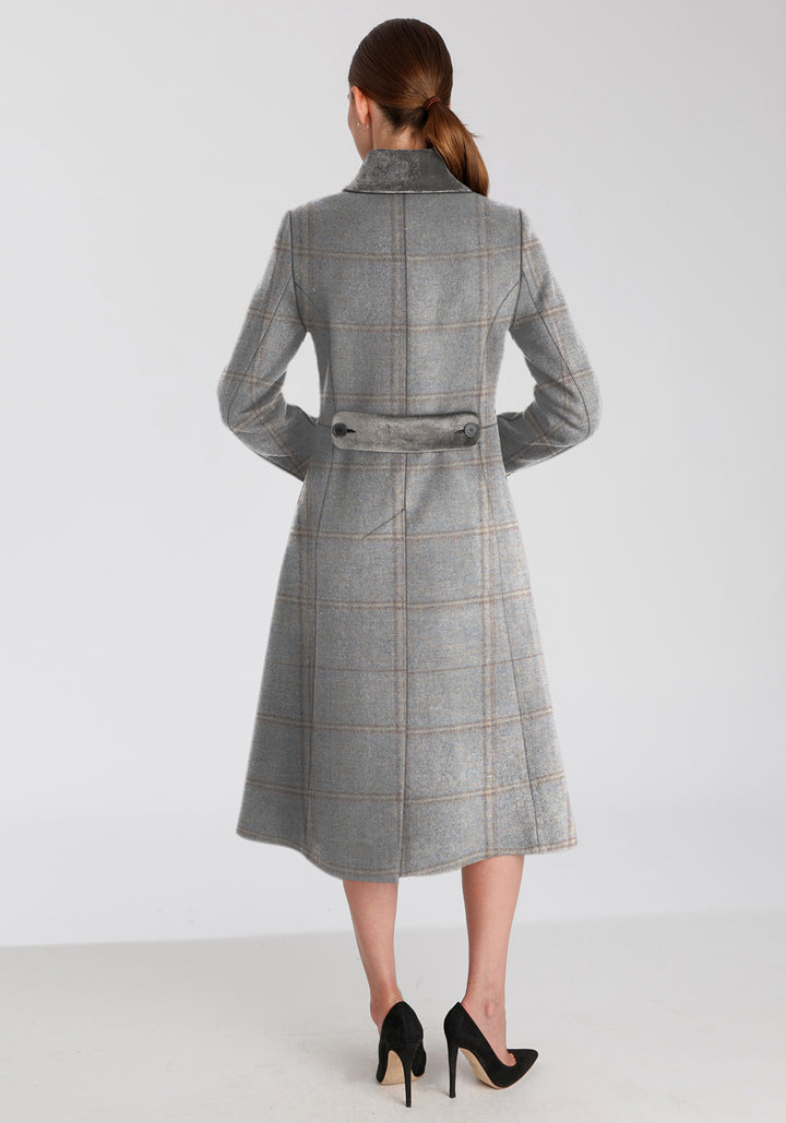 Back of woman wearing blue check coat with silver grey collar and back belt detailing