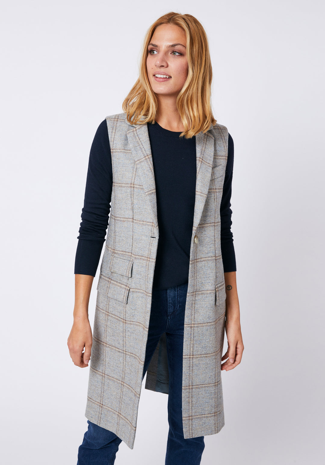 Woman wearing a blue grey check waistcoat