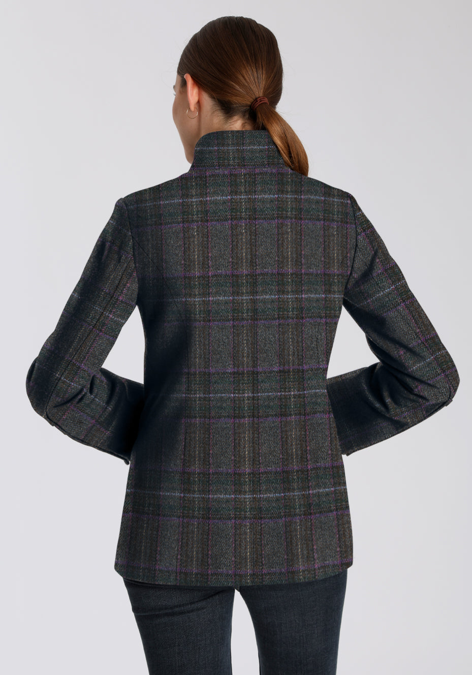 Back of woman wearing a purple checkered coat