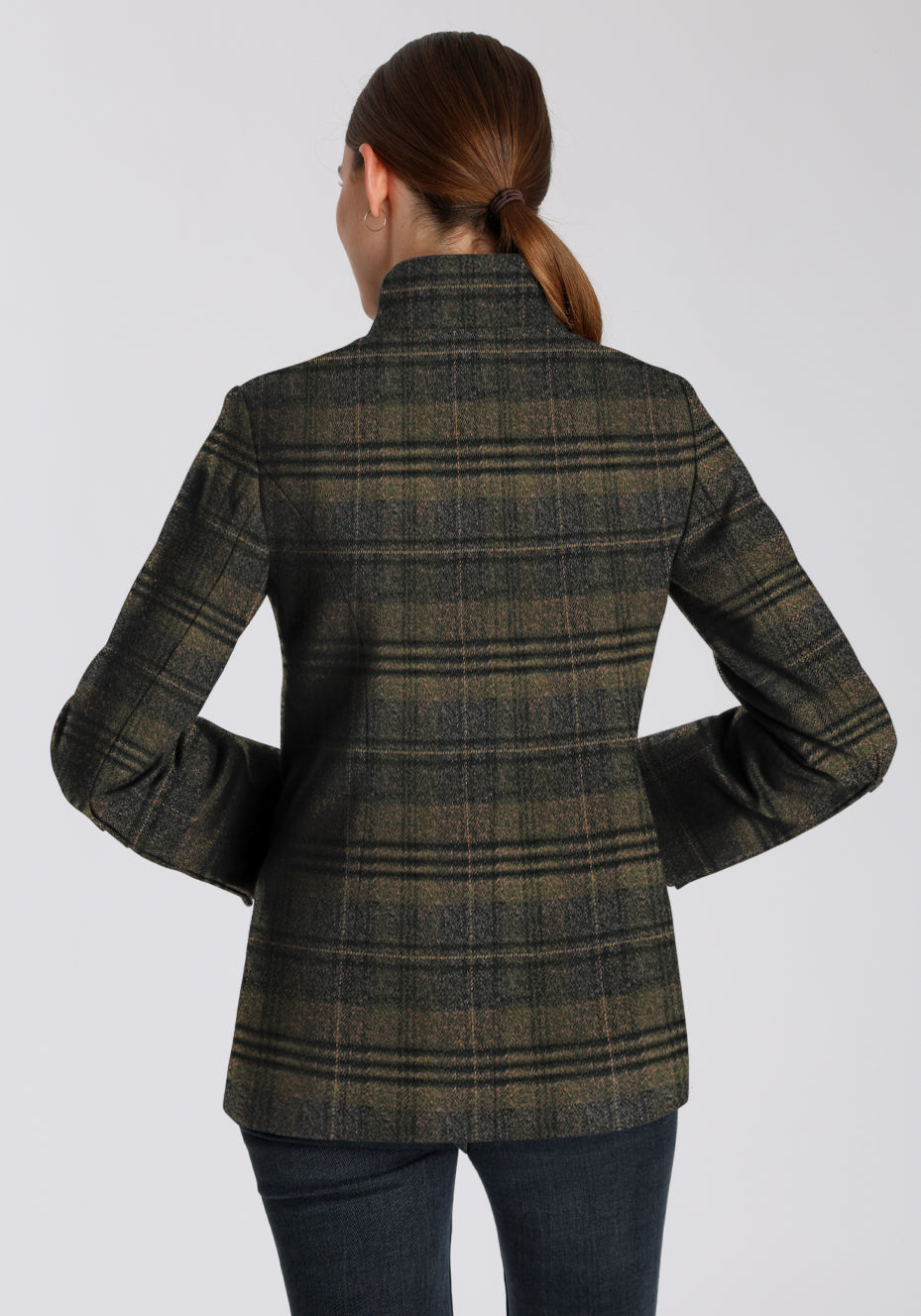 Back of a woman wearing a green check jacket on a white background