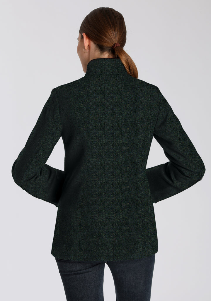 Back of a woman wearing a dark green jacket 