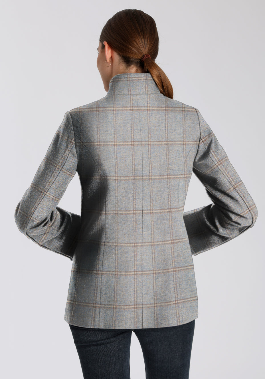 Back of a woman wearing a dove blue and cream checked jacket