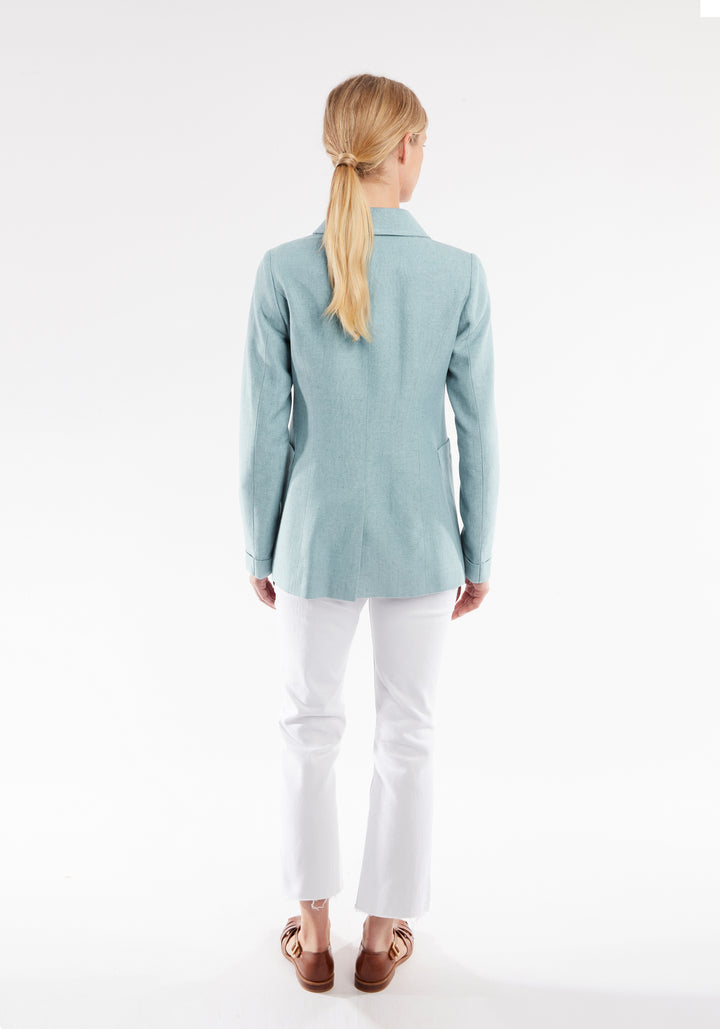 Back of woman wearing light blue jacket 