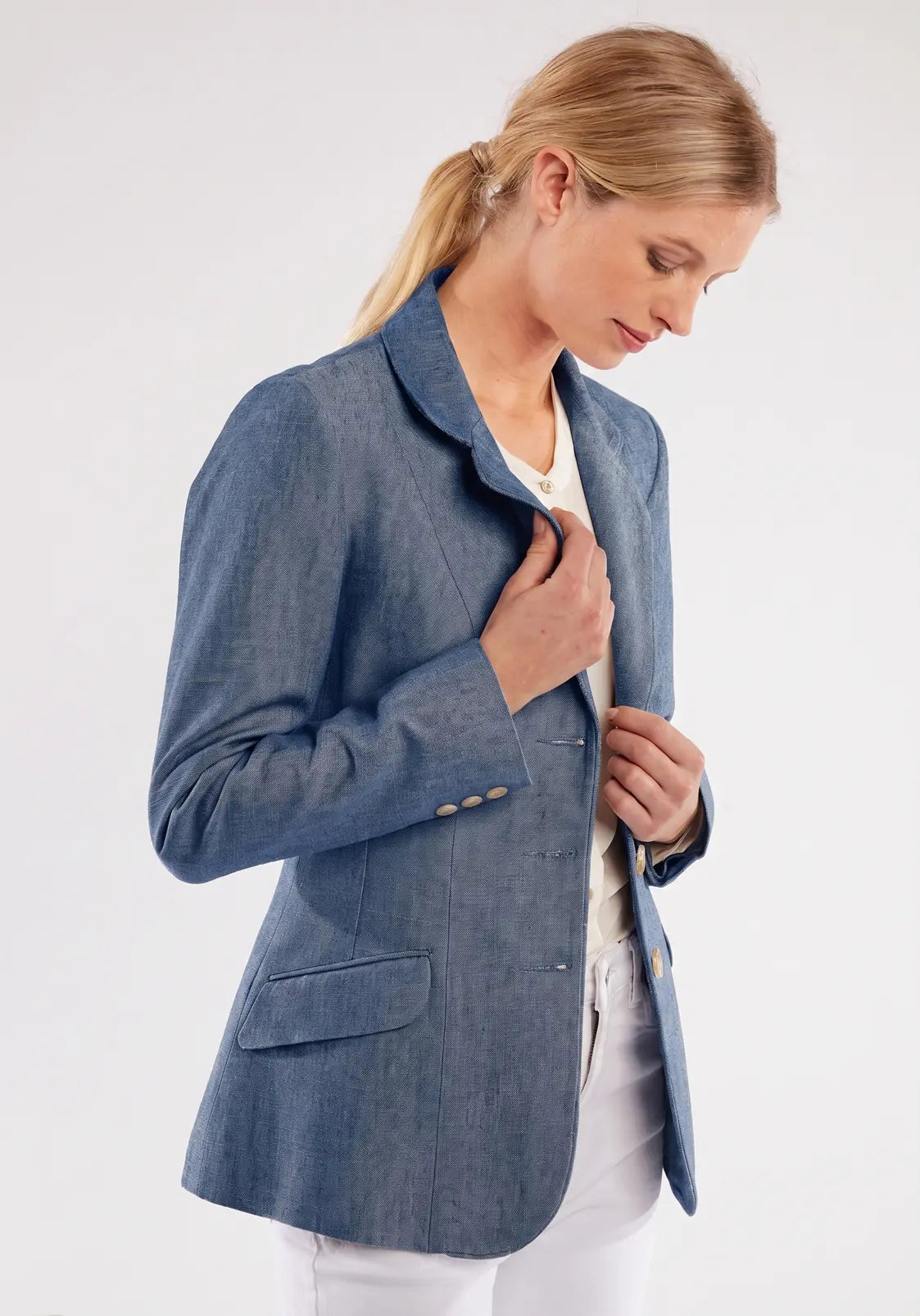Woman wearing a blue blazer on a white background