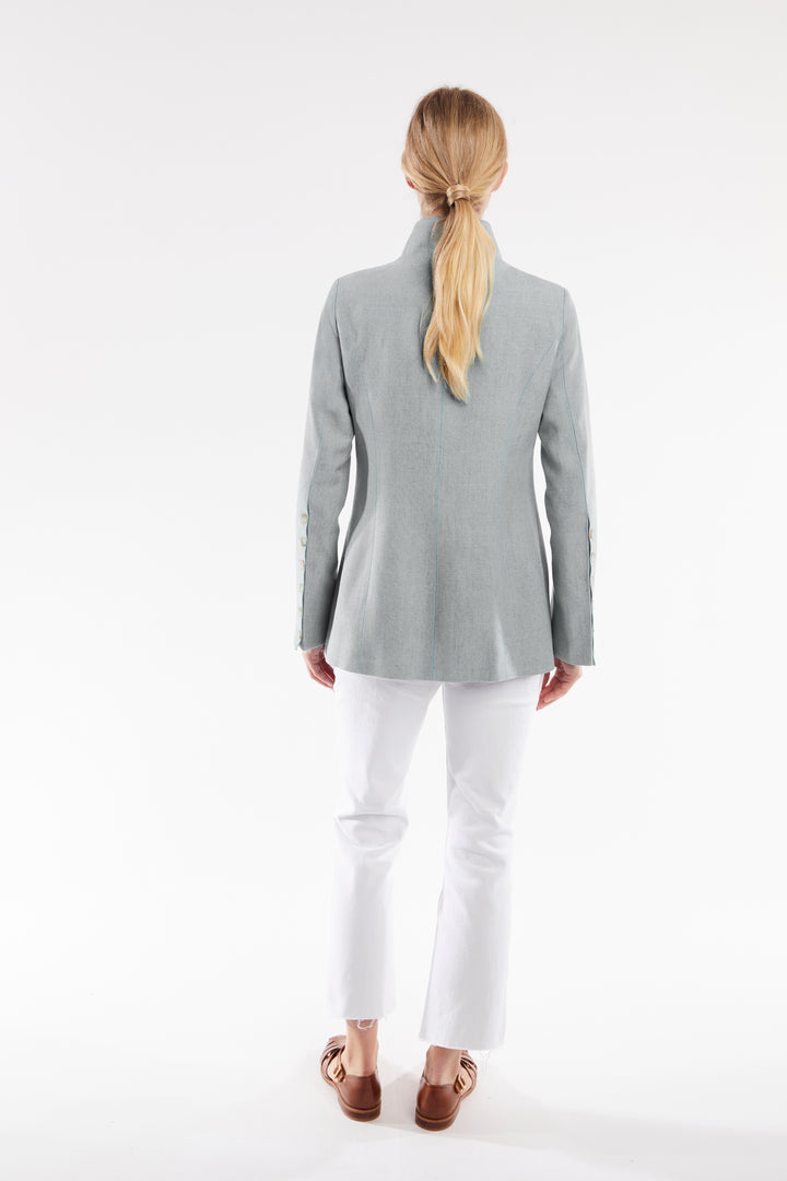 Woman wearing a gray jacket on a white background