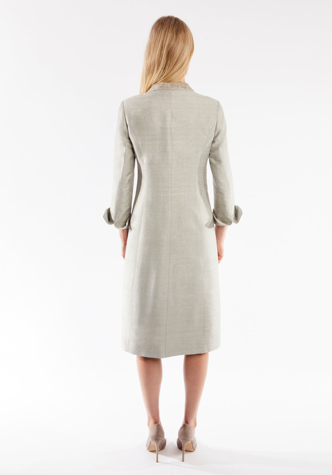 Back of woman wearing dove grey coat with cuff detailing