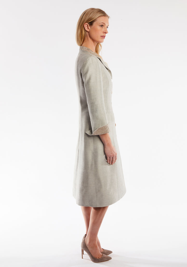 Side of woman wearing dove grey coat with cuff detailing 