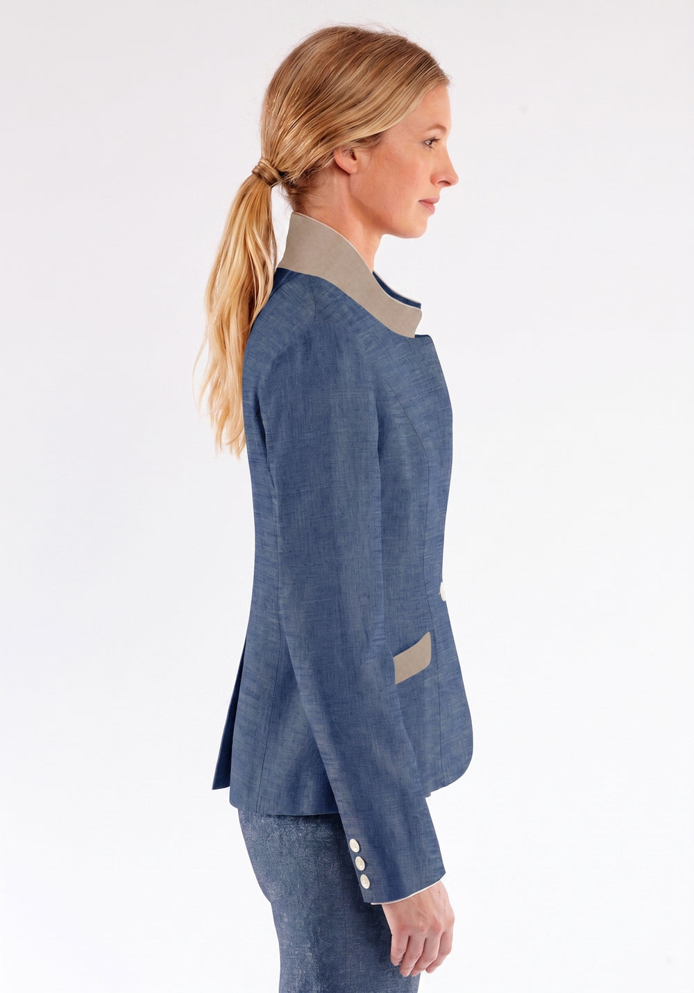 Woman wearing a blue jacket with a white background
